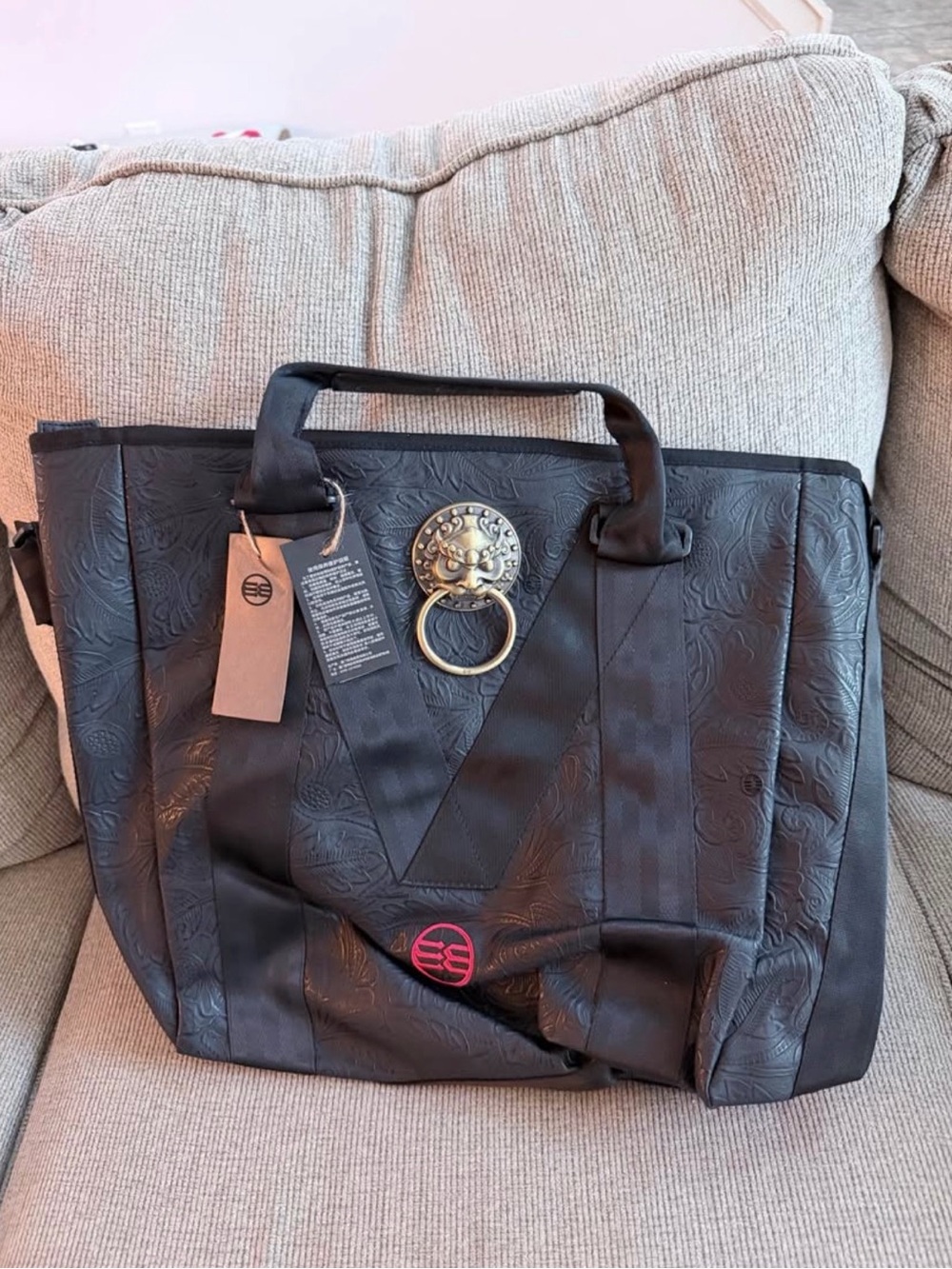 Black Embossed Tote Bag with Gold Ring Accent